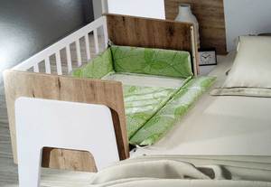 Cuna al lado cama
